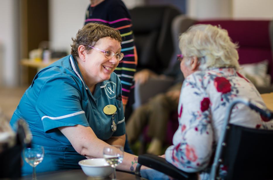 Whiteley Homes Trust team member with elderly woman